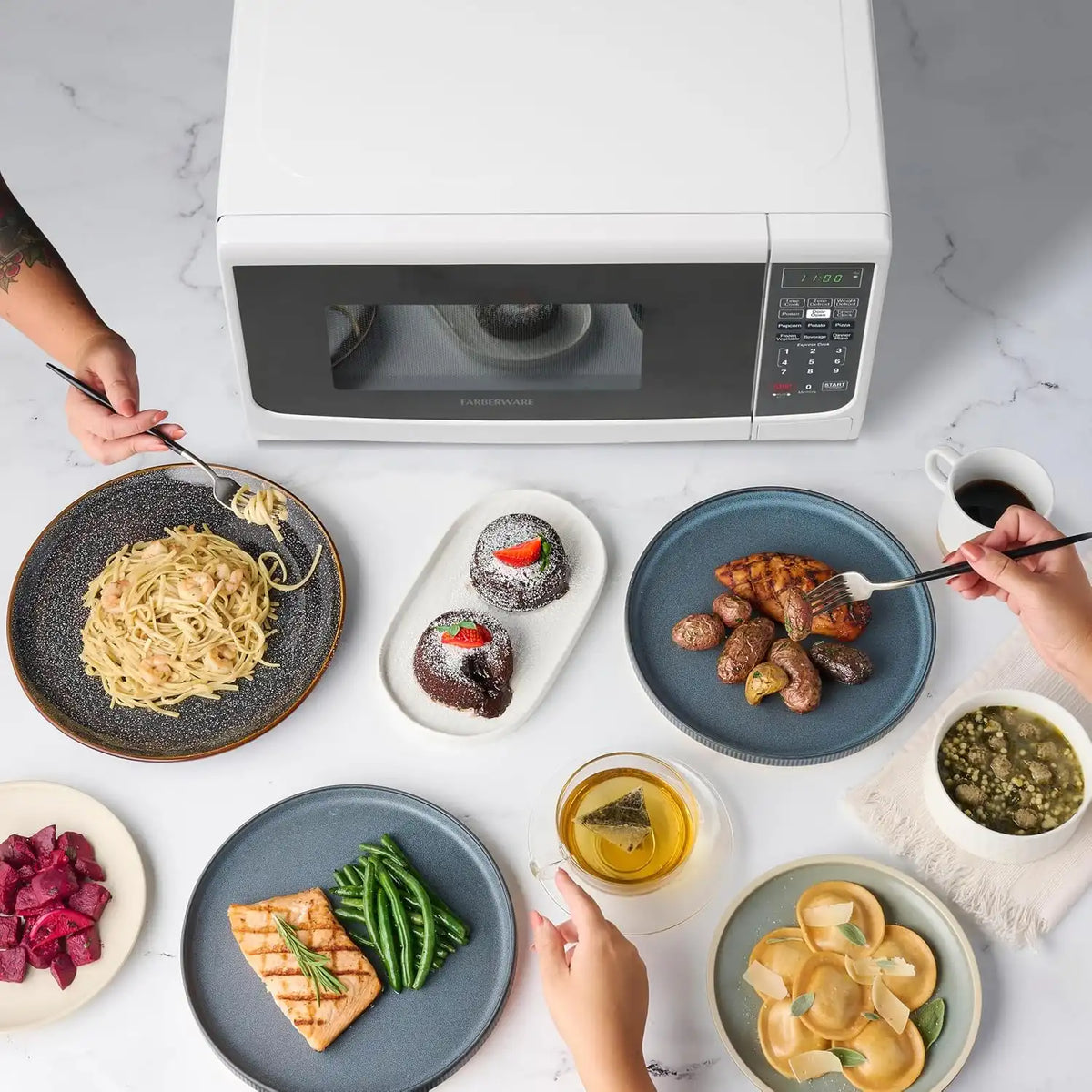 Farberware 0.7 Cu. Ft. Countertop Microwave Oven – 700 Watts Power, Auto Cook Settings, Defrost, Easy Clean and Child Safety Lock - White